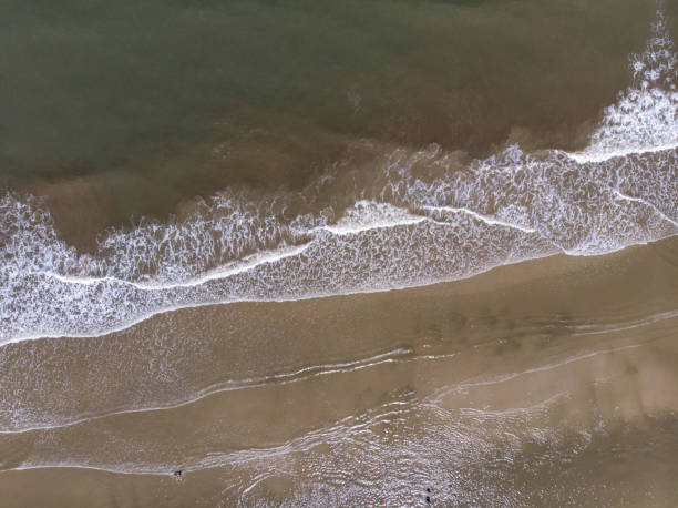 istock Aerial drone image view of ocean waves crashing on beach 1314116596