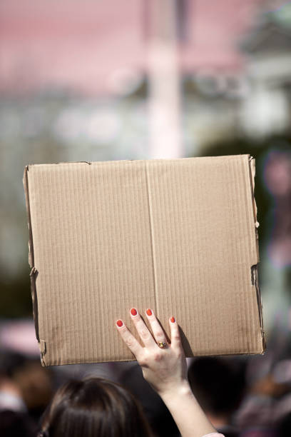 istock Protesters holding placards and signs on the streets. 1314128899