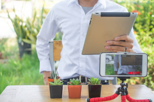 istock Man live streaming on smartphone 1314129211