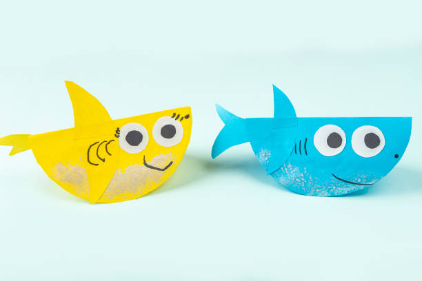 DIY and kids creativity. Making shark from paper. Children Craft workshop