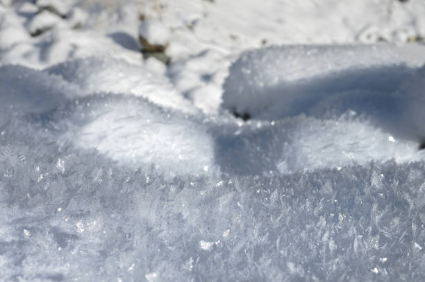 istock Large crystals on the snow surface on a sunny winter day. Winter background 1314134573