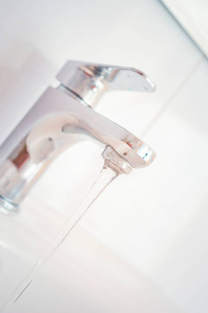 istock Hygiene concept. Water flowing from faucet. 1314135898