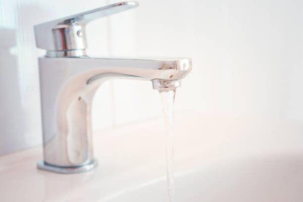 istock Hygiene concept. Water flowing from faucet. 1314135900