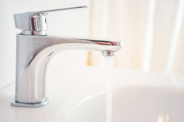 istock Hygiene concept. Water flowing from faucet. 1314135901