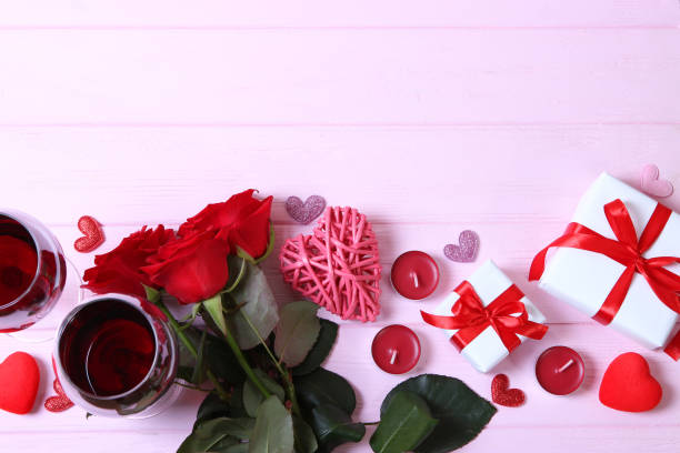istock red wine and roses on the table. Valentine's day background. 1314138081