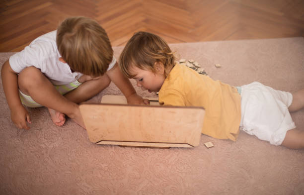istock Little brothers brother playing with interactive game. 1314140354