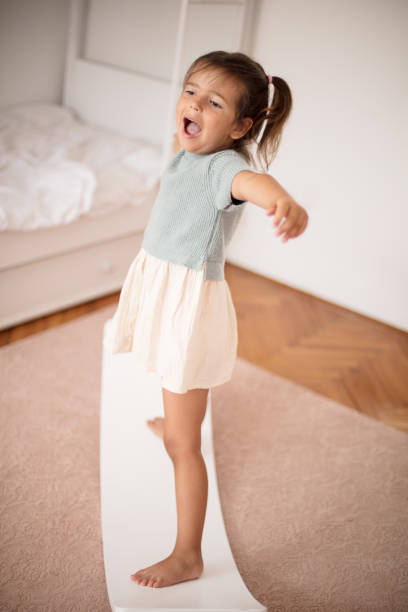 istock Little girl having fun in her bedroom. 1314140623