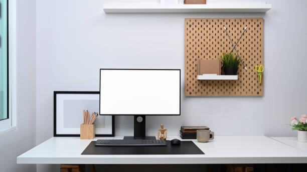istock Home office workspace with computer, digital tablet and office supplies on white table. 1314140648