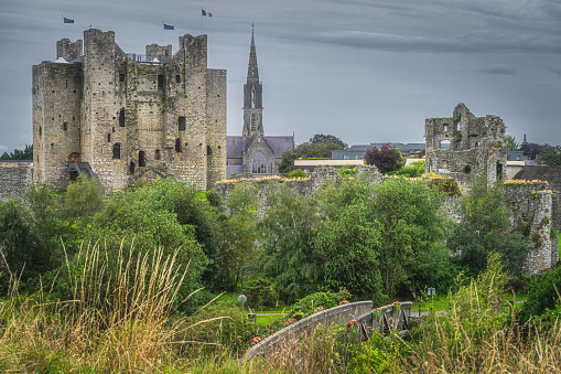 Trim, Ireland, August 2019 Old, ruined Trim Castle and St Patricks Catholic Church in the background in Trim village, County Meath