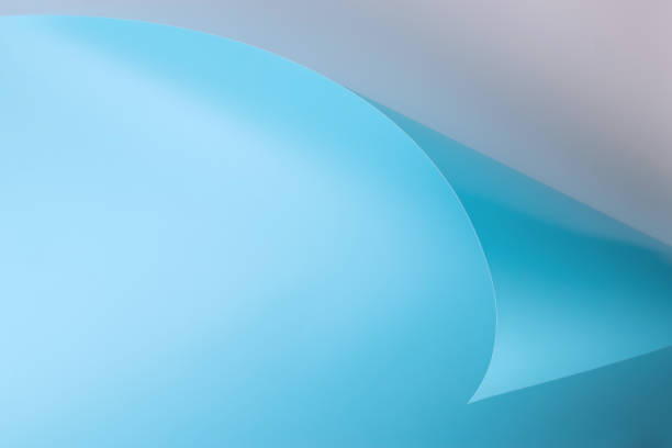 istock a sheet of blue paper with a curved corner on a gray background 1314142834