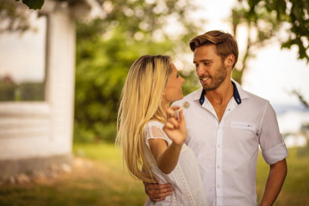 istock Couple With Keys Standing Outside. 1314146274