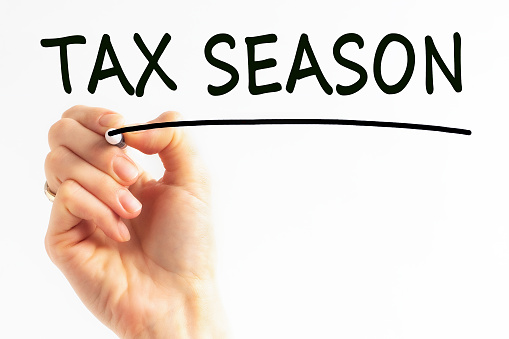 hand writing inscription tax season with black color marker, concept, stock image