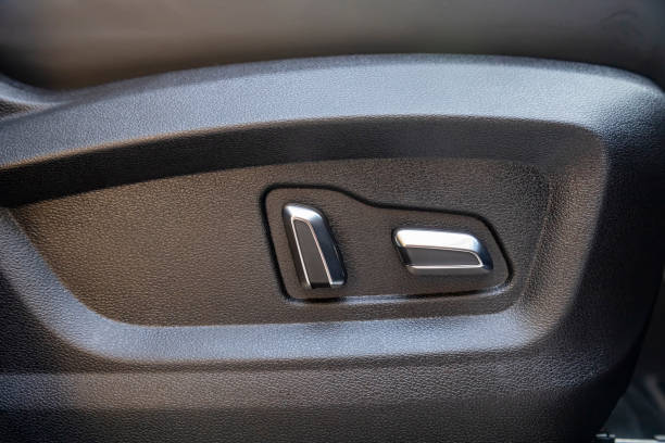 istock car seat electronic switch button. lever for electronic seat adjustment in a modern premium car. seat memory option 1314147445