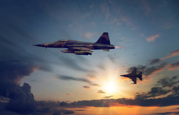 istock jet airplanes flying over the clouds at sunset. 1314148057