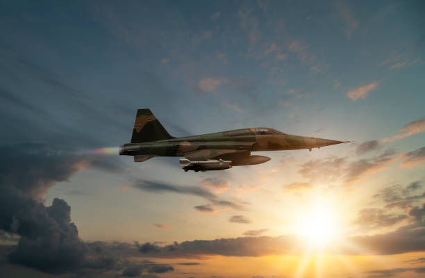 istock jet airplane flying over the clouds at sunset. 1314148085