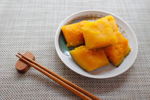 Boiled pumpkin Boiled pumpkin. Traditional Japanese food seasoned with soy sauce. kabocha stock pictures, royalty-free photos & images