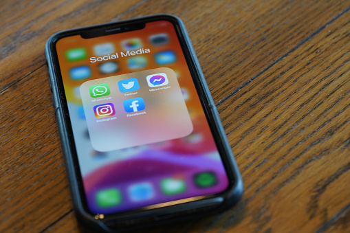 iPhone 11 Pro showing Social media applications on its screen