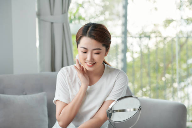 istock Beautiful young woman using cotton pad when applying toner on her skin 1314150964