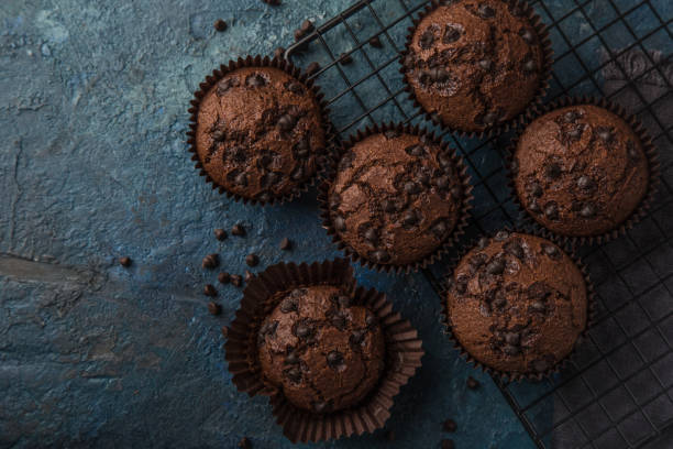 istock chocolate muffins on  dark blue background 1314154598