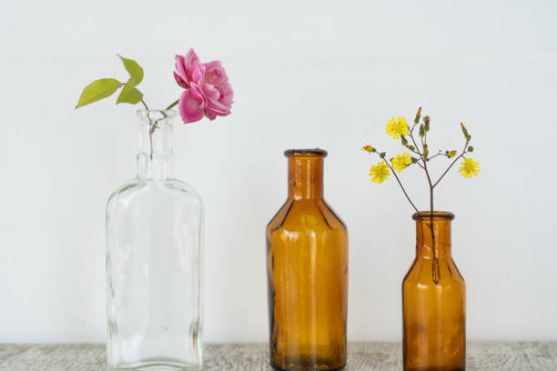 istock Antique jars and flowers on a white background 1314154746