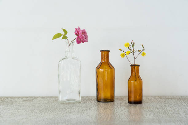 istock Antique jars and flowers on a white background 1314154768
