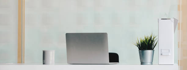 istock Remote workplace or home office during coronavirus outbreak. laptop, cup and notepad in living room at home 1314155688