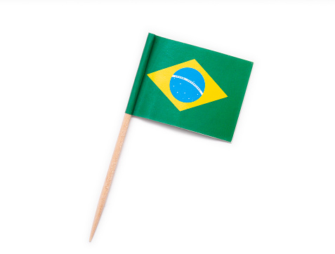 Paper flag of Brazil on wooden toothpick isolated on white
