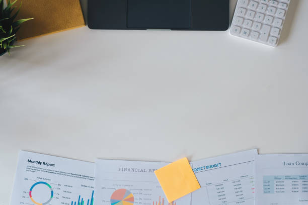 istock Accounting concept with laptop computer, calculator and financial documents on workplace with copyspace. Above view 1314155978