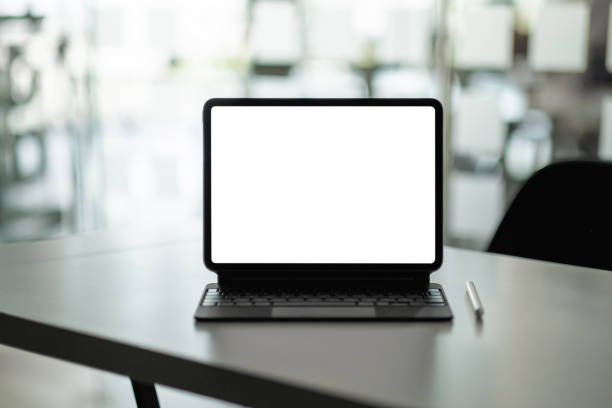 istock Mock up digital tablet with blank white screen on workplace at office. 1314156043