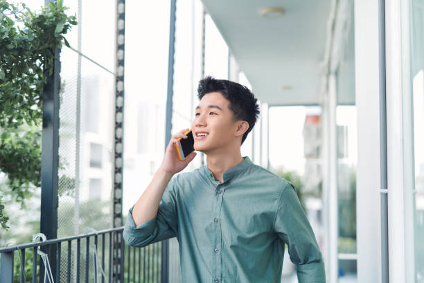 istock A portrait of man standing at a balcony making a phone call. 1314156178