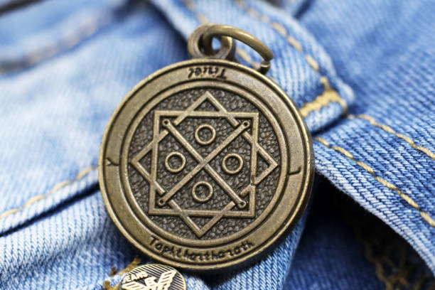 istock Old Money talisman and blue jeans so close 1314156516