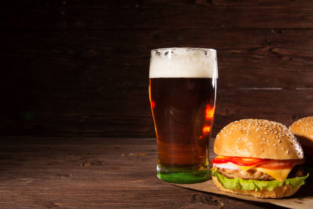 istock Hamburger and dark beer in vintage style 1314157569