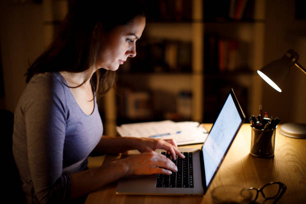 istock Woman working on laptop late at home 1314157843