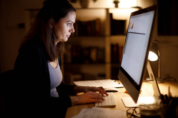 istock Woman working late on computer at home 1314157845