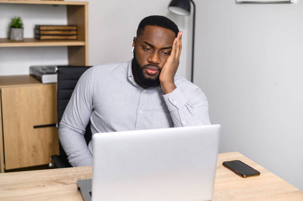 istock African-American male worker feeling sleepy 1314161285
