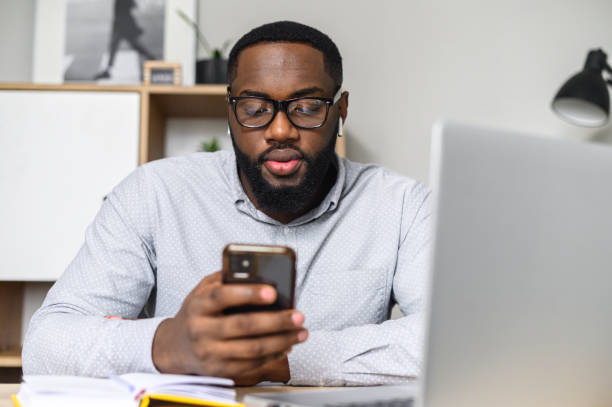 istock African-American guy working on his phone 1314161312