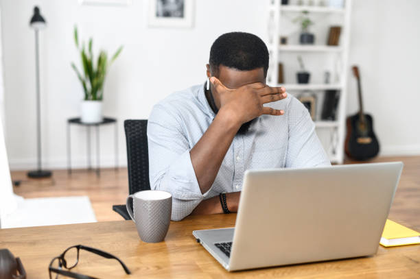 istock Young African-American office worker feeling tired 1314161892