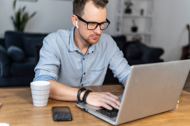istock A guy is using laptop sitting at the desk 1314163574