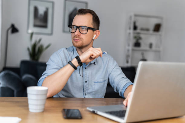 istock A guy is using laptop sitting at the desk 1314163593