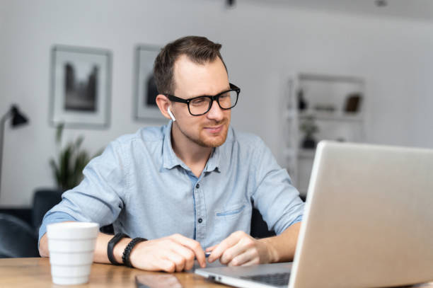 istock A guy is using laptop sitting at the desk 1314163600