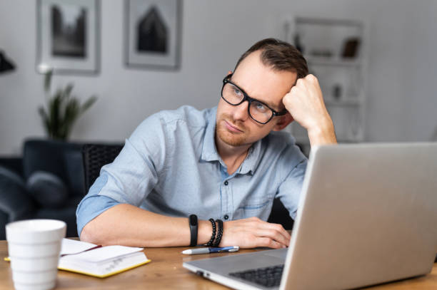 istock A guy is using laptop sitting at the desk 1314163651