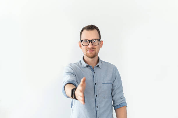 istock A guy holds out his hand in handshake gesture 1314163710