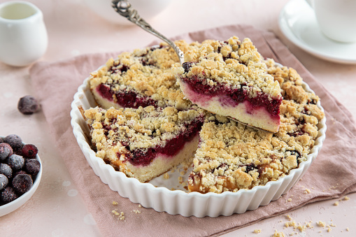 ricotta, berry and streusel tart, selective focus