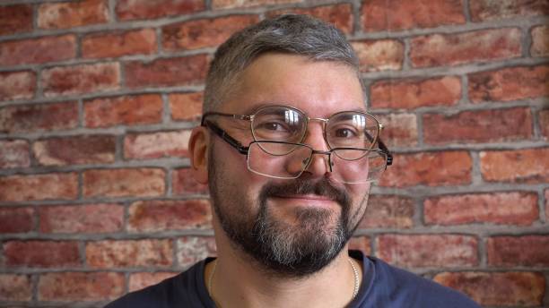 istock Cheerful man with glasses smiling 1314166148