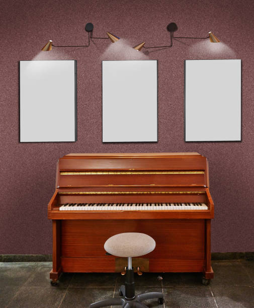 istock Old upright piano and a stool and three blank frames against Glitter wall. 1314168009
