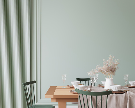 Wooden dining room mockup with wooden table and green chairs on empty wall, farmhouse style