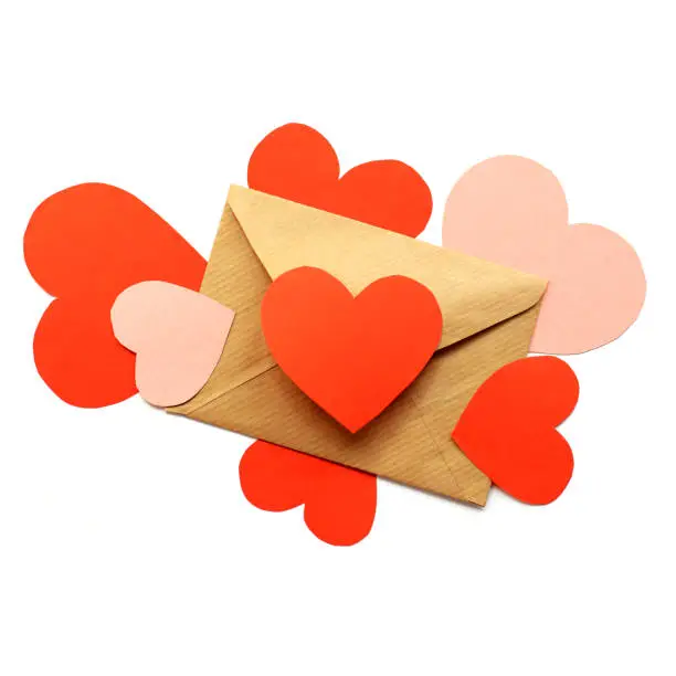 red and pink hearts symbols surround the paper envelope