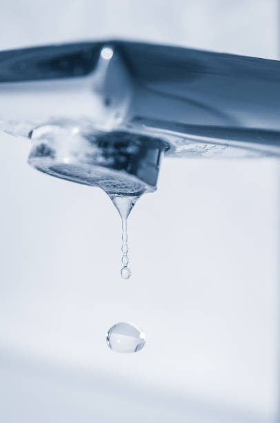 istock Water drops and faucet close up 1314172106