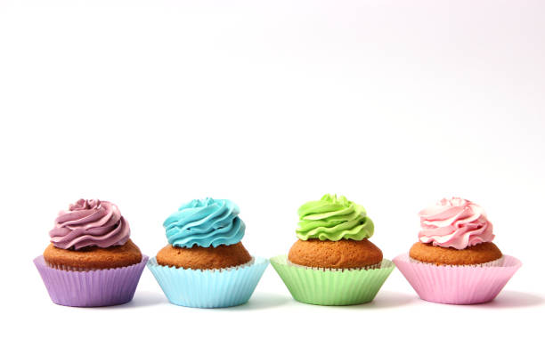 istock tasty cupcakes on a white background. 1314173429