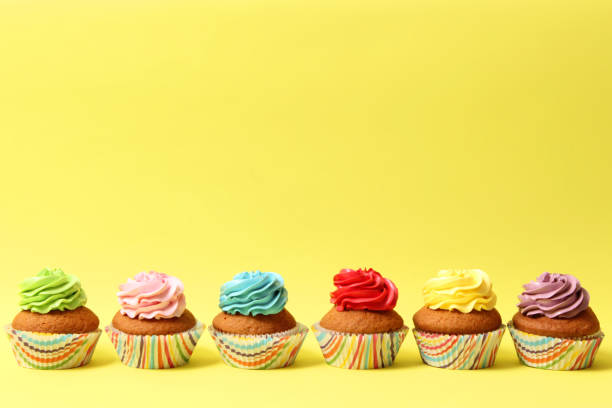 istock Delicious cupcake with a candle on a colored background with space for text. 1314174619